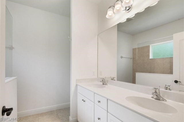 bathroom featuring tile patterned flooring and vanity