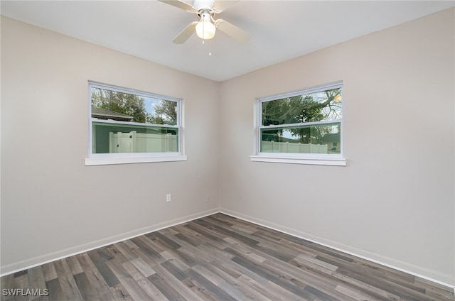 empty room featuring dark hardwood / wood-style floors and ceiling fan