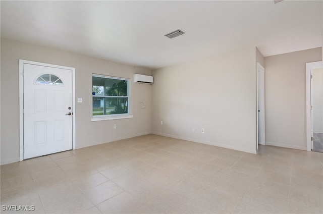 entrance foyer featuring a wall mounted AC