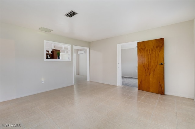 empty room featuring a wall mounted AC