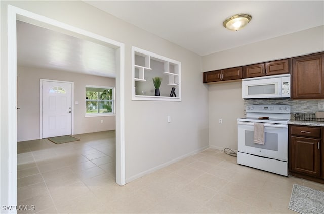 kitchen with decorative backsplash, dark brown cabinets, white appliances, and light tile patterned floors