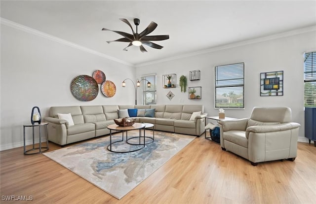 living room with light hardwood / wood-style floors and crown molding