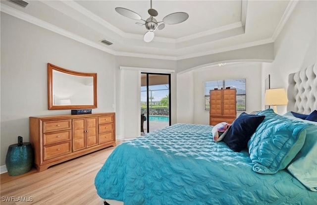 bedroom with access to exterior, light hardwood / wood-style flooring, ceiling fan, and ornamental molding