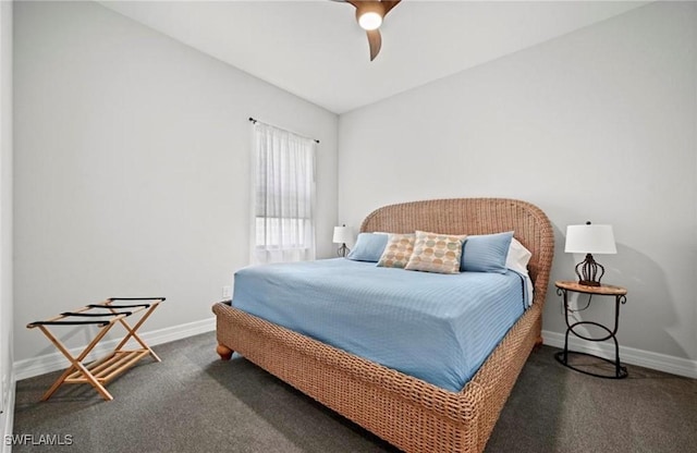 bedroom featuring ceiling fan, dark carpet, and lofted ceiling