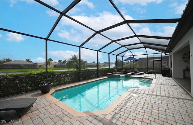 view of swimming pool with a lanai, an in ground hot tub, and a patio