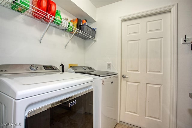 laundry area featuring washing machine and dryer