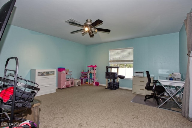 office space featuring ceiling fan and light carpet