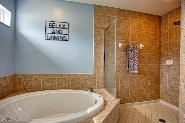 bathroom with tile patterned floors and plus walk in shower