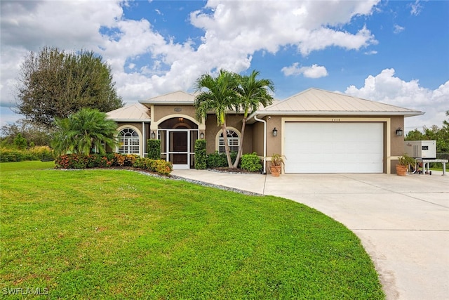 view of front of home with a garage and a front yard