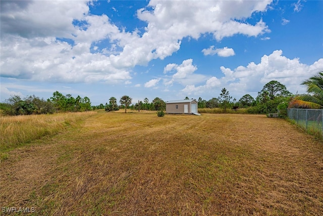 view of yard with a rural view