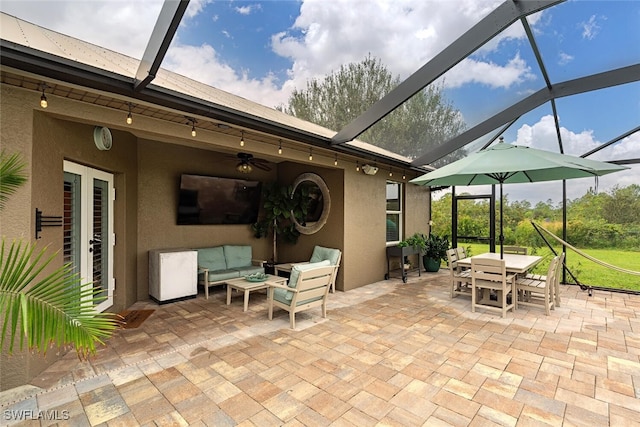 view of patio / terrace with an outdoor hangout area and a lanai