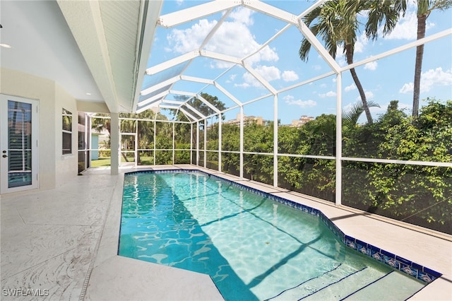 view of pool featuring a patio area and a lanai