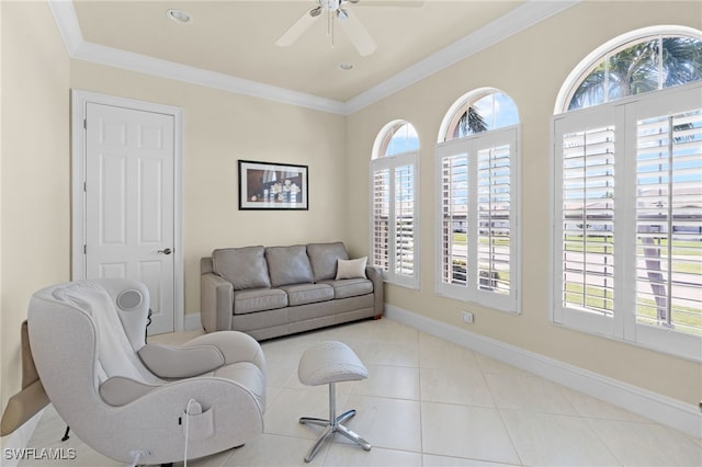 living room featuring tile patterned flooring, ceiling fan, and crown molding