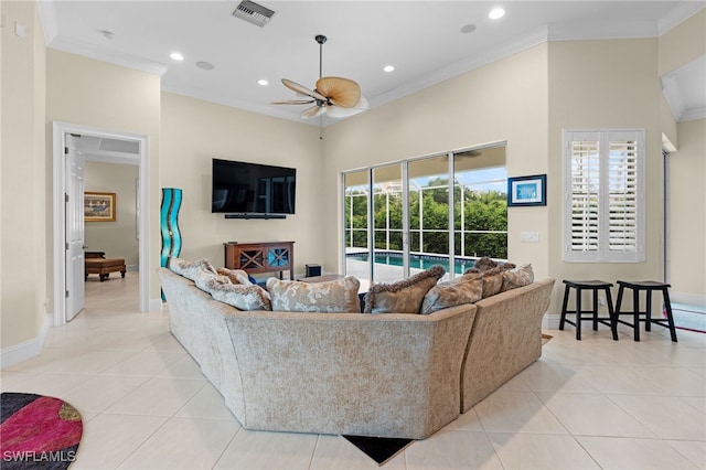 tiled living room featuring ceiling fan, ornamental molding, and a wealth of natural light