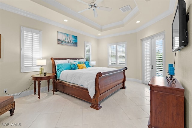 tiled bedroom featuring ceiling fan, a raised ceiling, crown molding, and access to outside