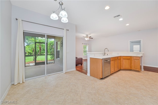 kitchen with ceiling fan with notable chandelier, sink, light hardwood / wood-style flooring, stainless steel dishwasher, and decorative light fixtures