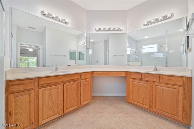 bathroom with vanity, tile patterned floors, walk in shower, and ceiling fan