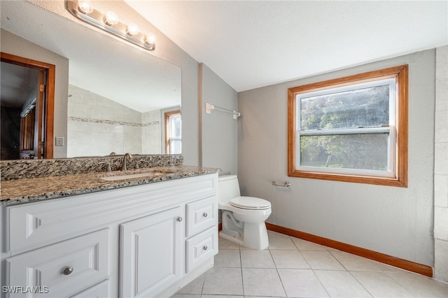 bathroom with tile patterned floors, a textured ceiling, vaulted ceiling, toilet, and vanity