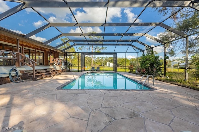 view of pool featuring a lanai and a patio