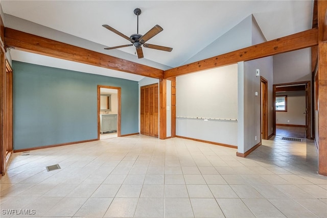 spare room featuring light tile patterned floors, high vaulted ceiling, and ceiling fan