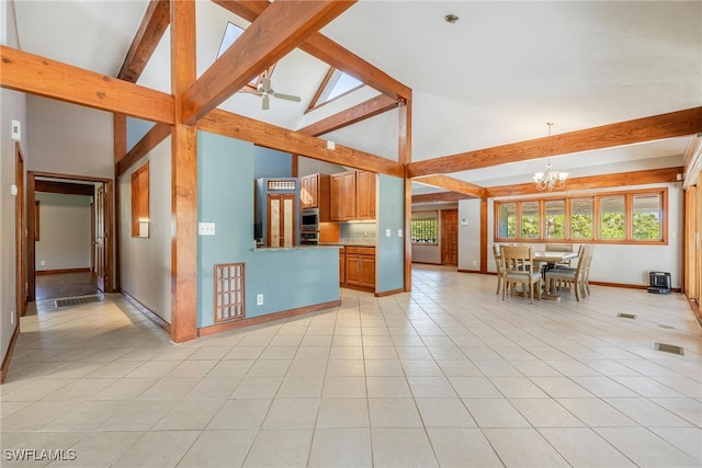 unfurnished living room with ceiling fan with notable chandelier, beamed ceiling, high vaulted ceiling, and light tile patterned floors