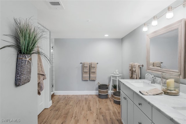 bathroom featuring hardwood / wood-style floors and vanity