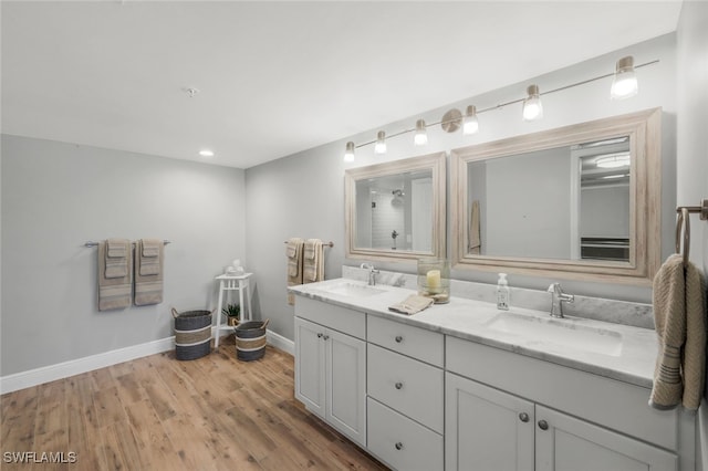 bathroom with vanity and hardwood / wood-style flooring