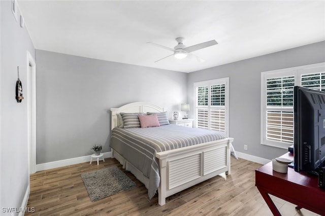 bedroom featuring ceiling fan and hardwood / wood-style floors