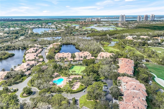 birds eye view of property with a water view