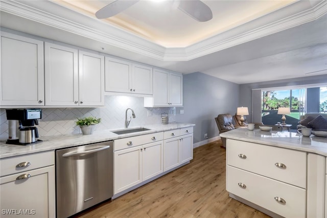 kitchen with dishwasher, white cabinetry, sink, and light hardwood / wood-style flooring