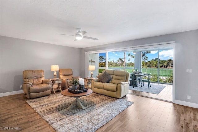 living room with hardwood / wood-style floors and ceiling fan