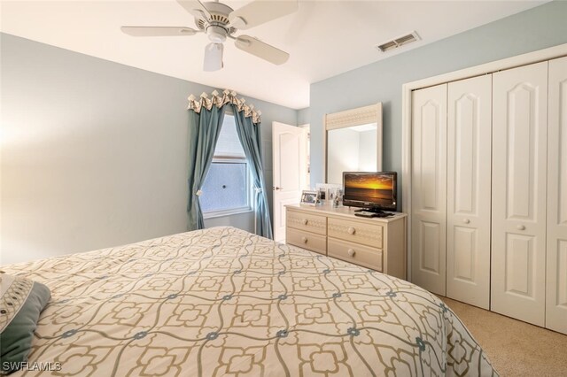 bedroom with carpet flooring, ceiling fan, and a closet