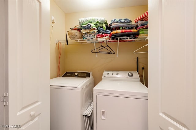 laundry room with independent washer and dryer