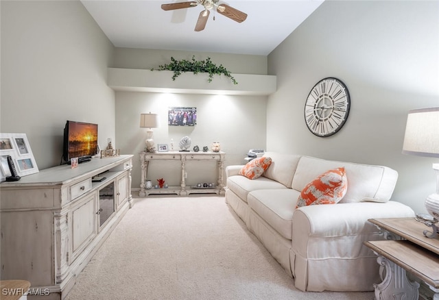 carpeted living room featuring ceiling fan