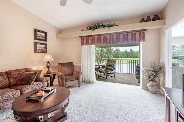 living room featuring carpet flooring, a wealth of natural light, ceiling fan, and lofted ceiling