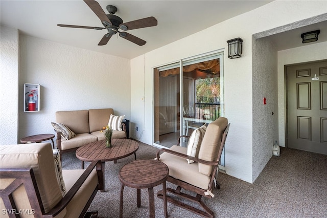 exterior space featuring outdoor lounge area and ceiling fan