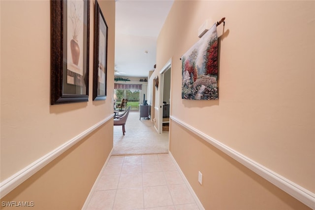 hallway with light tile patterned floors