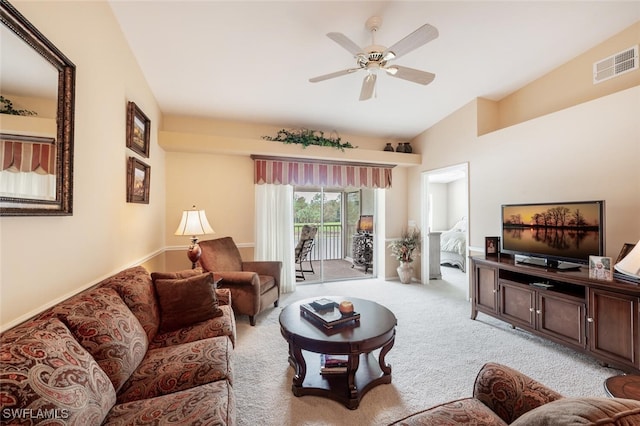 living room with light colored carpet, ceiling fan, and lofted ceiling