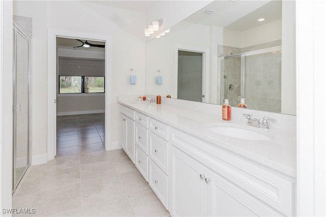 bathroom with vanity, tile patterned floors, and walk in shower