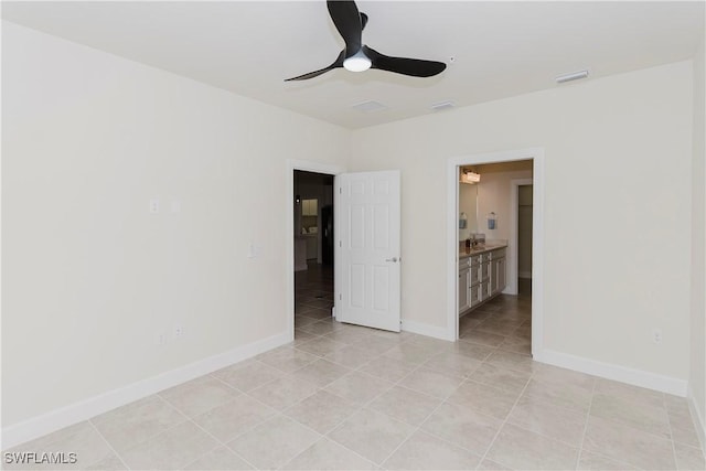 unfurnished room featuring light tile patterned flooring and ceiling fan