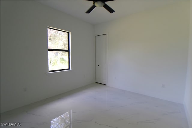 empty room featuring ceiling fan