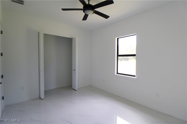 unfurnished bedroom featuring a closet and ceiling fan