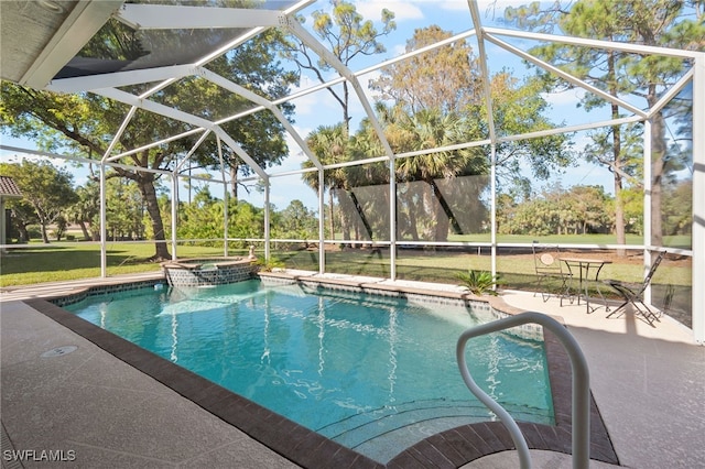 view of swimming pool with a patio area, a lanai, and a yard