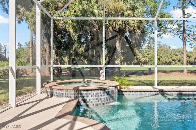 view of swimming pool featuring an in ground hot tub and a lanai