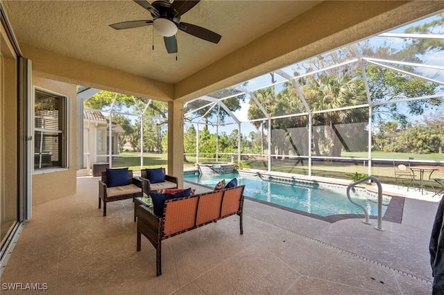 view of swimming pool with an outdoor hangout area, a patio area, ceiling fan, and a lanai