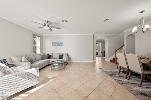 living room with ceiling fan with notable chandelier and ornamental molding