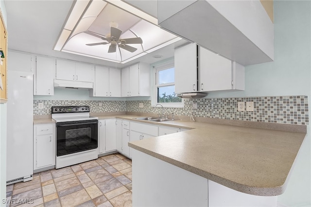 kitchen with kitchen peninsula, backsplash, white appliances, sink, and white cabinets