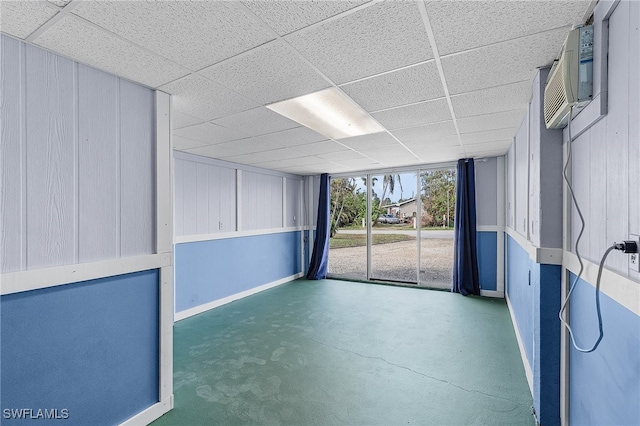 empty room featuring a paneled ceiling