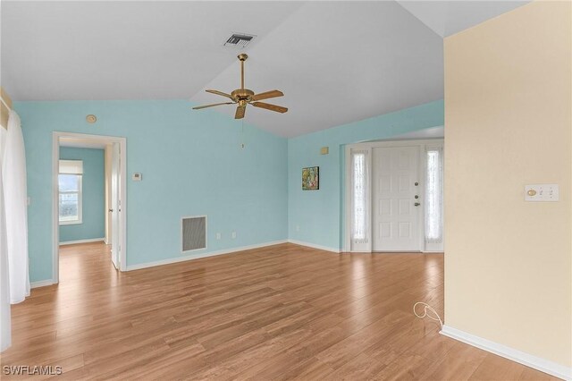 unfurnished living room with vaulted ceiling, light hardwood / wood-style flooring, and ceiling fan