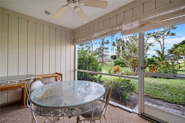 sunroom with ceiling fan and a healthy amount of sunlight